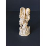 C19th Chinese ivory carving of a fisherman selling his wares with a boy summoning customers, 18cmH