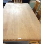 Pine top dining table with pedestal base and Arts & Crafts style oak sideboard