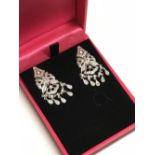 Pair of 14 carat white gold diamond drop earrings