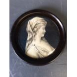 C19th Continental School, portrait miniature of a 'Lady' in profile, en grisaille