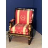 C19th mahogany elbow chair in the Empire taste, gilded Sphinx arm supports on fluted tapering legs