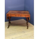 Regency mahogany crossbanded sofa table on downswept reeded end supports, 157cm fully extended