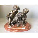 Grand Tour patinated bronze figure group depicting 2 cherubs & goat with grapes on a marble base
