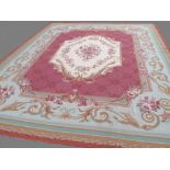 Finely hand woven needlepoint carpet of Aubusson style, with central cream floral medallion,