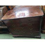 George III mahogany chest of two short and three long graduated drawers between blind fret canted