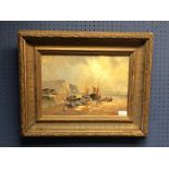 Gilt framed oil painting, Seascape with beached fishing boats and fisher folk on shoreline, 25x36cm