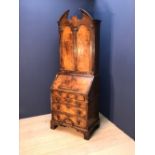 Queen Anne style burr walnut double dome bureau cabinet, starburst inlaid modern broken pediment and