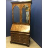 George II walnut bureau bookcase with adjustable shelves & mirrored doors over fitted bureau with
