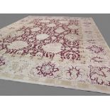 Fine Contemporary Agra carpet with neutral coloured ground and dark maroon ground central panel, 3.