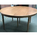 Modern circular breakfast table with extra leaves extending to an oval, 160cm dia extending to 260cm