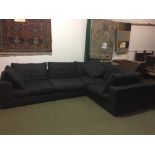 L-shaped sofa upholstered in black material