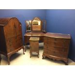 1920's walnut four piece bedroom suite comprising dressing table, domed top chest/cupboard, chest of