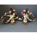 Pair of porcelain parrots on gilt metal work with porcelain flowers candelabra 34cmH