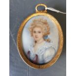 C19th School, portrait miniature of a 'Lady wearing blue dress', indistinctly signed & dated '1846'