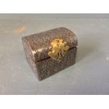 Miniature velvet lined steel domed lidded casket with brass clasp with embossed lattice
