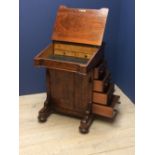 Victorian walnut Davenport with sloping fall & bank of single drawers on sledge end supports - bears