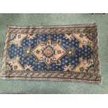 Old Persian rug with fawn/pale pink and navy ground in traditional design..& 3 others (4)