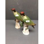 Pair of late C19th Meissen woodpeckers, 28cm high, some losses to beaks and branches