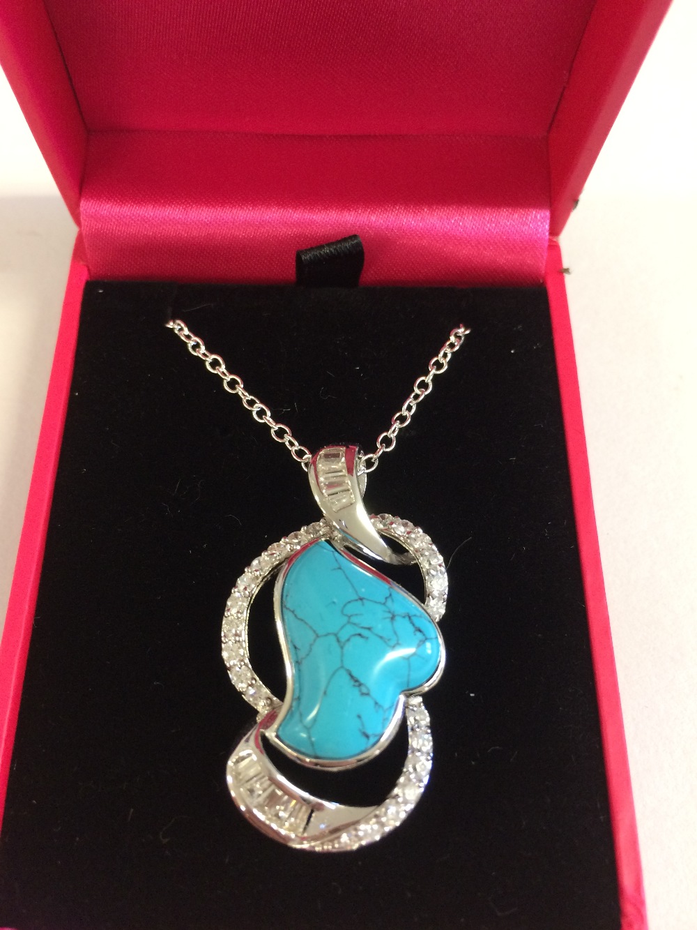 Silver, cubic zirconia and turquoise set pendant necklace