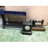 Late C19th French slate timepiece, a sewing machine & a plate rack