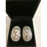 Pair of silver and cubic zirconia hoop earrings in the form of hearts