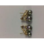 Pair of yellow gold double South Sea pearl earrings