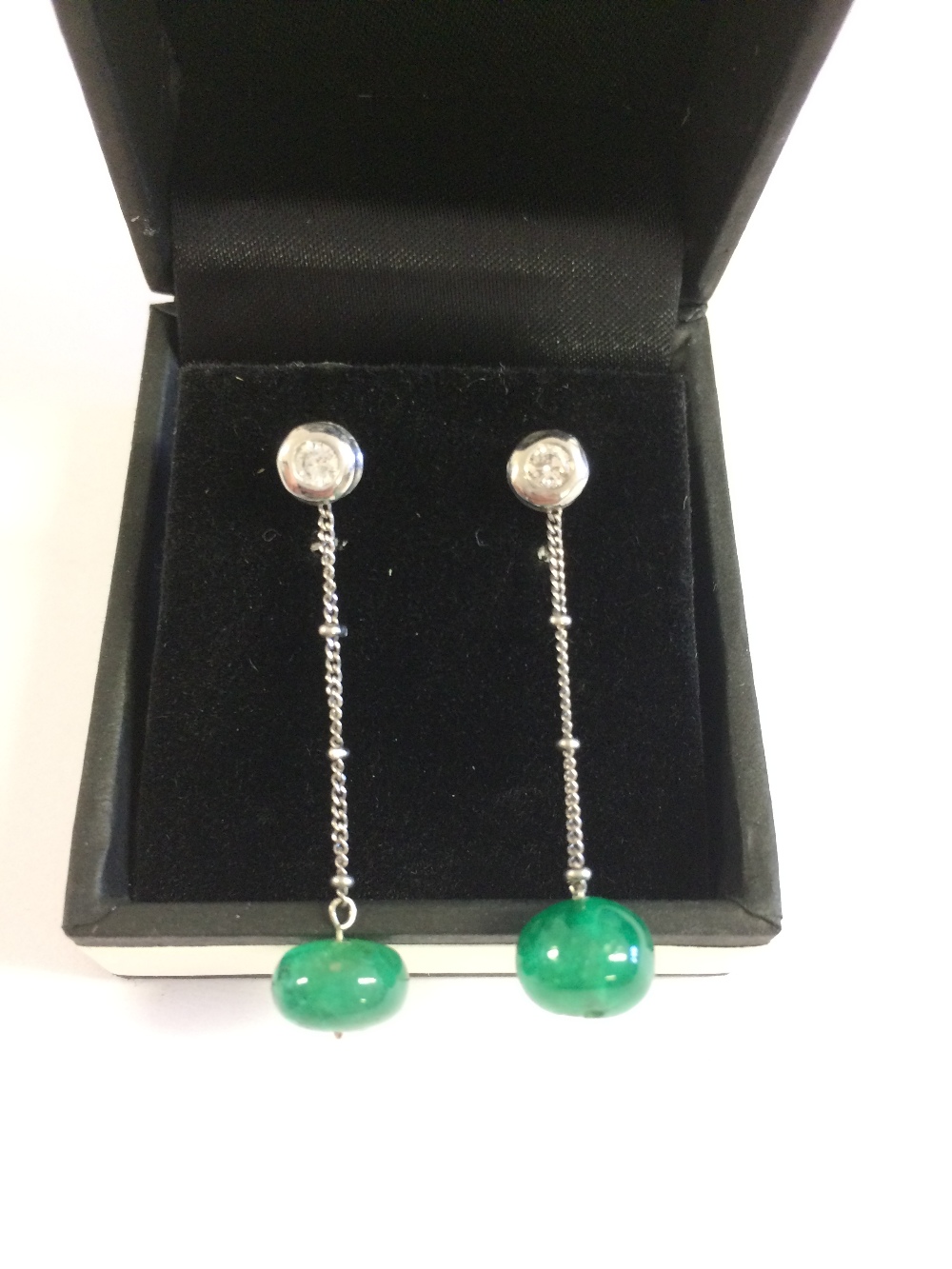 Pair of white gold, emerald and diamond drop earrings