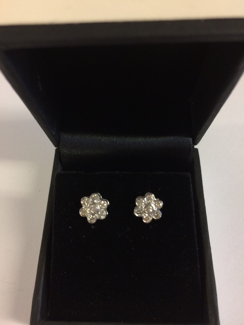Pair of 18 carat white gold and diamond, daisy style, stud earrings