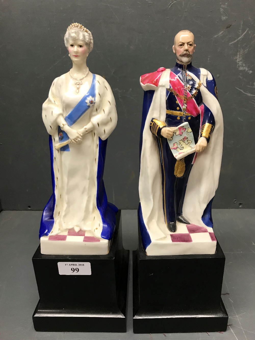 Pair of Royal Worcester porcelain figures of HM King George V and Queen Mary, each on ebonised