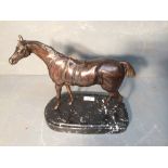 French School, a bronze figure of a Stallion under saddle, raised on a marble base, 26cmH