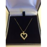 14 carat yellow gold, heart shaped, diamond pendant necklace