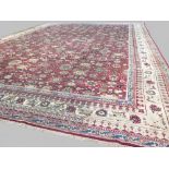 Rare and striking C19th Indiamn Agra carpet 5 x 3.73m with red square central ground and wide