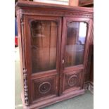 Carved mahogany glazed bookcase with adjustable shelves and a bow front dresser (2)