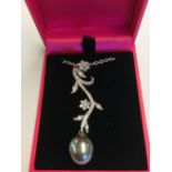 White gold and diamond pendant necklace of flower form with South Sea pearl drop