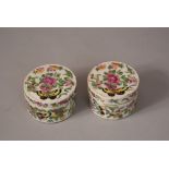 Pair of C19th Chinese famille rose circular boxes and covers decorated with butterflies flying