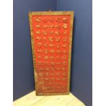 Chinese red painted textured rectangular panel with rows of calligraphy, 139x60cm