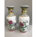 Pair of Chinese porcelain rouleau vases, floral decoration with imperial yellow neck, signed,