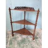 Victorian rosewood three tier corner whatnot with barley twist column supports