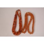 Chinese amber necklace designed as two rows of graduated faceted beads; together with a strand of