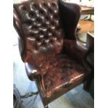Traditional, gentleman's brass studded red leather winged library armchair with buttoned seat &