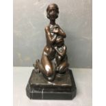 Bronze study of a seated Mother and Child on a polished stone plinth 33 cm H