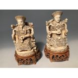 Pair of Chinese dynasty ivory carved okimono of seated Emperors on throne chair, square seal mark to