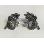 Pair of silver marcasite and sapphire set earrings in the form of peacocks