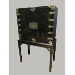 C19th Chinese black lacquered and gilt mounted cabinet on stand upper section decorated in shallow