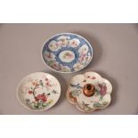 Three C18th/19th Chinese famille rose dishes, the first painted with a bird perched on flower