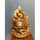 Black Forest carved mantle clock with squirrels & acorns, to an 8 day movement & blue enamel Roman