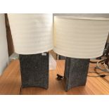 Pair of triangular grey, granite effect, lamps with cream shades