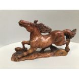 Chinese hardstone figure of a roaming horse on wooden base