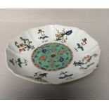 Chinese Doucai decorated dish with floral sprigs & sprays, 21.5cm dia