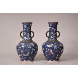 Pair of C18th/19th Chinese famille rose vases flanked by twin handles, decorated with butterflies